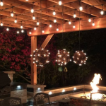 outdoor string lights installed by Pavestone Brick Paving