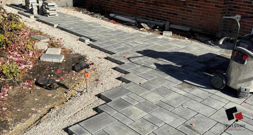 Installing patio pavers by the Pavestone Brick Paving team horizontal